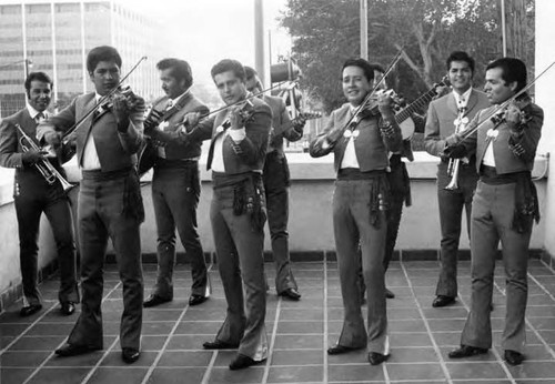 Mariachis playing on the balcony of the Biscailuz building