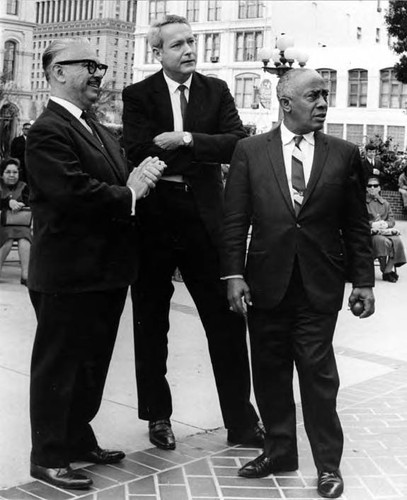 Gilbert Lindsey in Plaza with two men