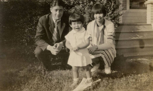 Jake and Dorothy Siu with Shirley Ann in a yard