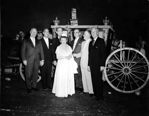 Christine Sterling with Earnest Debs, Roy Ball, Chief Barker, Judge Brown, John Anson Ford, Judge Faries in front of a coach