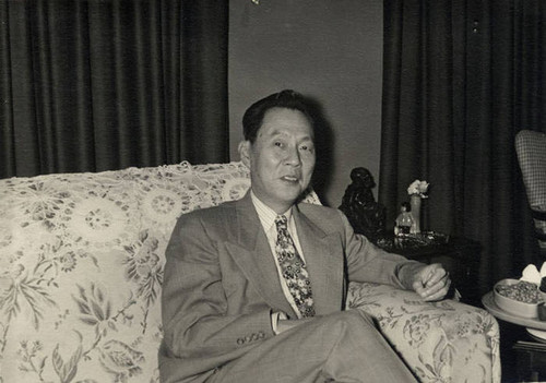 Stanley H. Chan in his living room at home in 1259 South Windsor Blvd., Los Angeles. The photo was taken by Dr. Michael of Loyola University's English Department