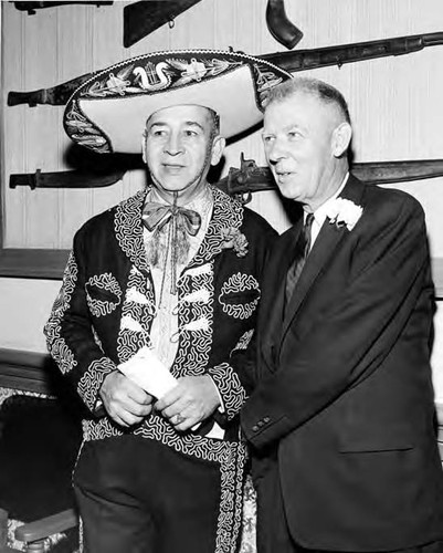 Close-up of two men standing inside the Simpson building