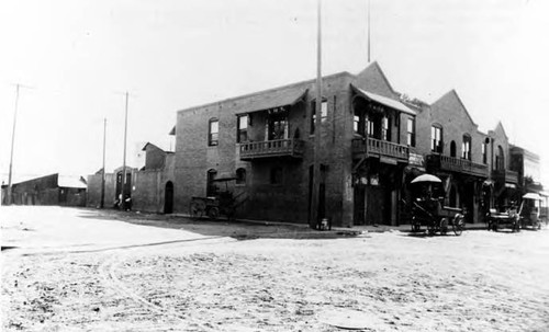 Corner of Juan and Apablasa Streets. Upper id hr "Tin How Mui" temple. downstairs about 1915 Dock Hop Co. Notice there's a sign in American letters-that's Gus Armbuster's harness chop-next with few Chinese characters in our poolroom and cigar store. "The Young China" owned by Thomas Ung. Sai Ho Hong