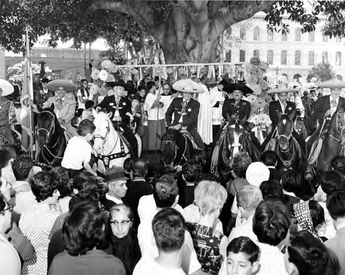 Riders, including Hernando Courtright, in front of Bishop Ward