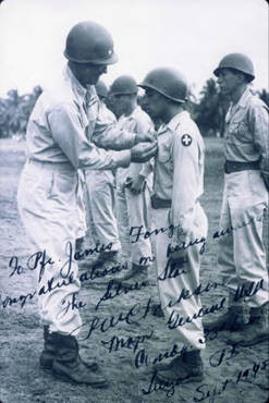 James Fong receiving a silver star. Written on the photo is a congratulations to Mr. Fong on receiving the silver star