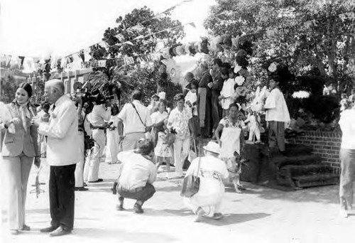 Crowds of people clebrating in the Plaza and on Olvera Street