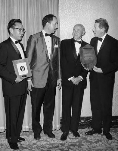 Delbert Wong received an award, along with Danny Kaye, at a dinner sponsored by the National Conference of Christians and Jews. From left to right are: Delbert Wong, Thomas Sarnoff, V.P. of NBC, Samuel Goldwyn, founder of MGM, and Danny Kaye