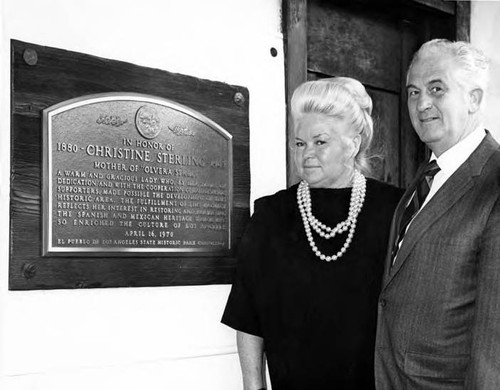 June and Jack Parks posing next to the Christine Sterling plaque