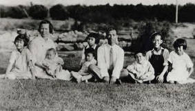 The George Ng Quon family at the Woo Family's Plummer St. Asparagus Ranch in the San Fernando Valley. Present are Emma, Mrs. Quan Ying, baby Lily, Lucy at father's knee, Eva behind Lucy, Mr. Quan Ying, Clara, Milton and Barbara