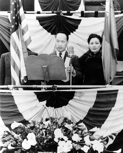 Close-up view of Madame Chiang Kai Shek and a man