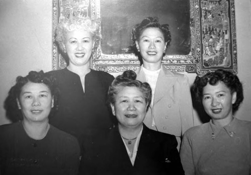 The Chung sisters: Florence Chung Lon, Mildred C. Handel, Anna Chung Yip, Margaret J. Chung, and Dorothy Chung Siu. (Dorothy is seated at right and Mildred Chung has a paratrooper's or submariner's badge on her left pocket)