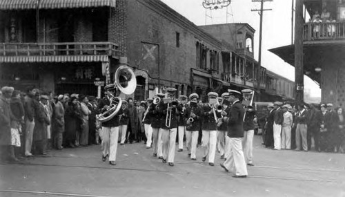 A band directed by Peter Soo Hoo Sr. performing in Old Chinatown on Alameda Street, which is now the site of Union Station