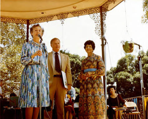 El Dia de los Personas Mayores, Jean Bruce Poole, Arthur Snyder, and Miriam Matthews standing in kiosko