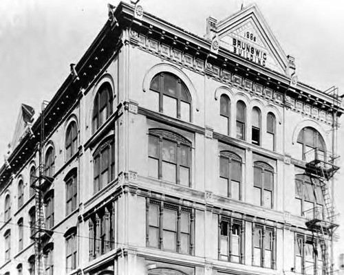 Vickrey/Brunswig Building on Main and Republic Streets. Old style street lamp and awnings in front