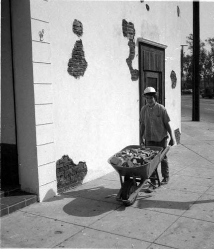 Man with wheelbarrow