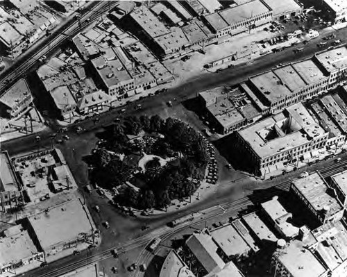 Aerial view of the Plaza and surrounding buildings (Pico House, Brunswig Drug Co., Plaza Substation, Lugo Adobe, Garnier, Jeannette Block)
