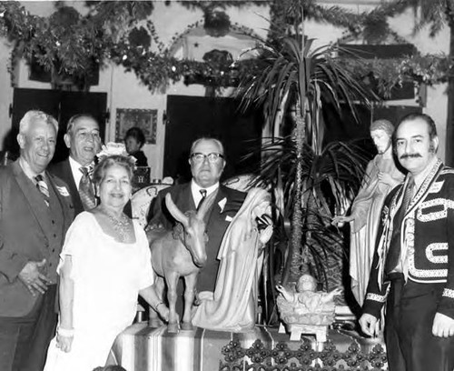 Mario Valadez, Sra. de Bonzo, Reynoldo Carreon, Carl Dentzel, and Bill Sousa around the nativity scene