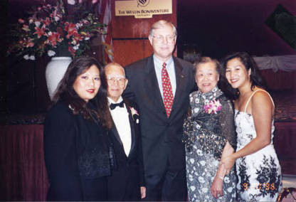 From left to right: Mrs. Tom Wong (honoree), Poy Wong (honoree), Mike Antonivich (supervisor), Barbara Wong and her granddaughter at the Chinatown Service Center banquet