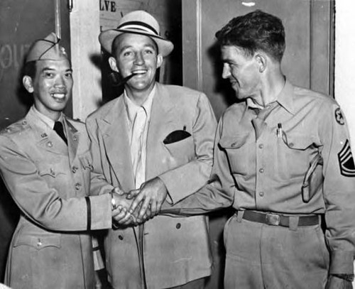 Major Victor Quon with Bing Crosby and a writer