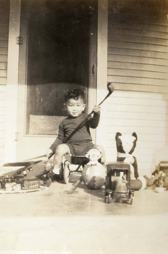 Rodney Chung seated among toys in Riverside, California