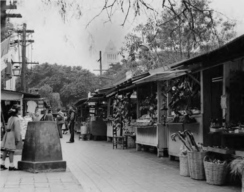 Olvera Street and puestos with City Hall in background