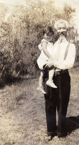 Two year old Ronald Siu and his grandfather