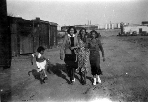 Three women and a girl in old Chinatown, Marchessault Street