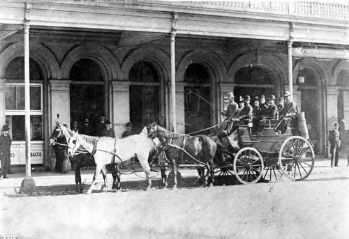 Pico House through the Plaza, with horse carriage in front