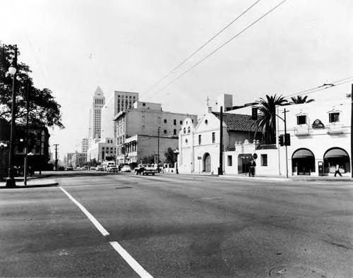 Main Street showing frontal view of Plaza Church. Courthouse and City Hall are also depicted. Manhole in foreground