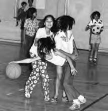 "Shot Out" three girls playing basketball on an indoor court