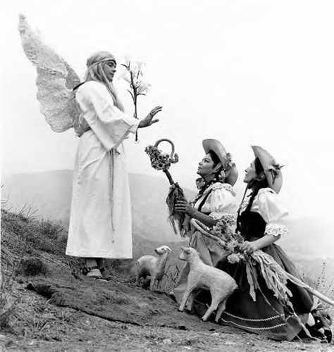 An angel telling shepherdesses how to get to Bethleham