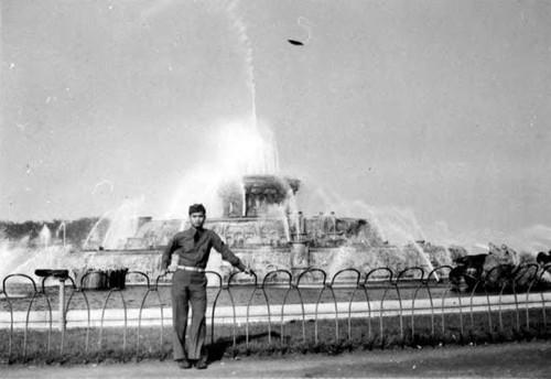 Man in uniform and fountain Negative only