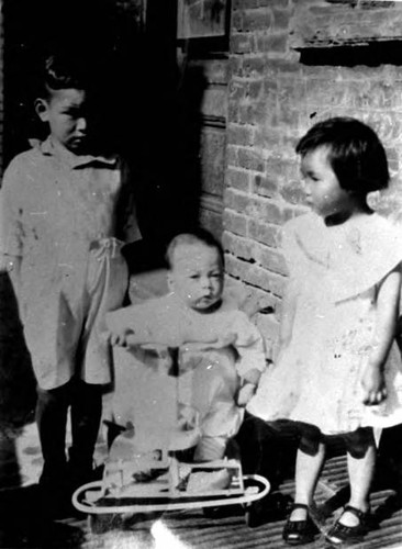 Three children, on of which is Howard Quon