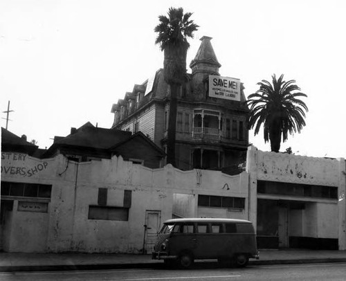 Rochester house with a sign "Save Me! Historic Los Angeles Fund"