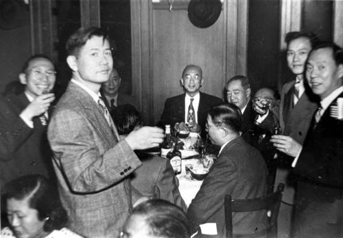 At San Francisco Cafe celebrating Walter Lum's 75th birthday. There were 10 tables. All his son-in-laws were standing up, giving him a toast. He had over 100 guests, 7 children, grand kids, relatives and friends. (George Lew second from left)