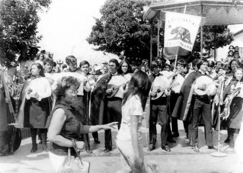 Crowds of people clebrating in the Plaza and on Olvera Street