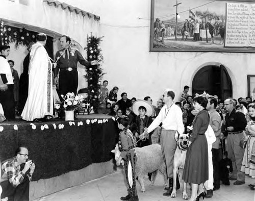 Crowd in front of priest