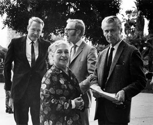 Consuelo Bonzo standing with two men