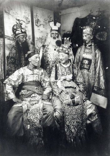 Non-Chinese pretending to be Chinese in China City, wearing Chinese opera make-up and costume, a tourist activity