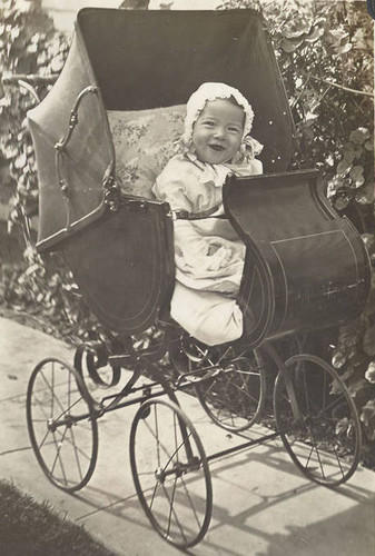 Jake as a baby in a carriage