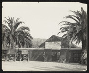 Sales Depot California Nursery Company, Two automobiles Parked in Front, Man Standing Next to the Entrance, circa 1920s