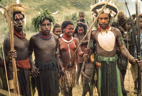 Men and women decorated for ceremonial occasion