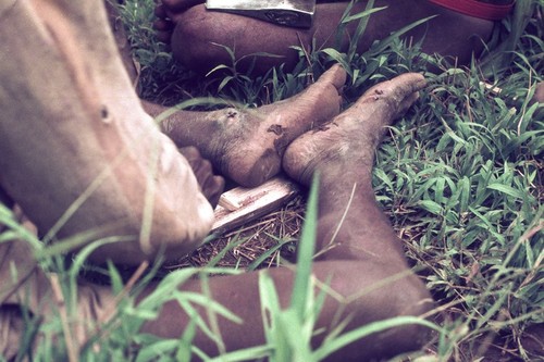 Showing a traditional practice: fires were started by rubbing a wooden stick in a groove