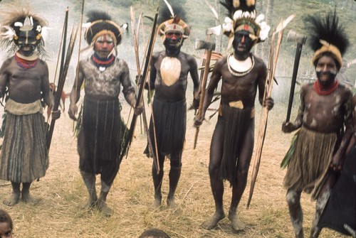 Decorated men intone chants about ceremonial and political prowess