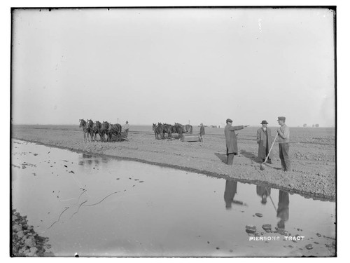 Scraper teams working at the Pierson land development near Merced