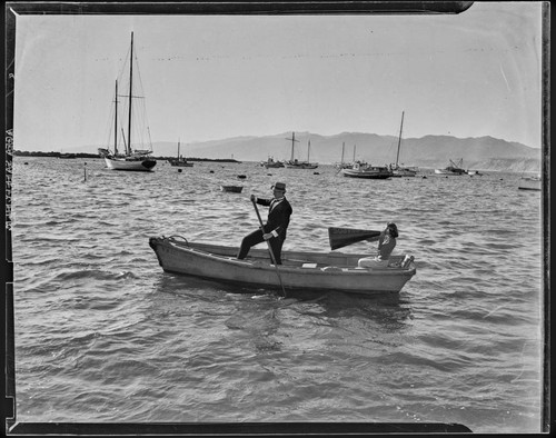 Man and a woman in a lifeguard boat off the Santa Monica coast