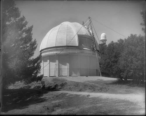 The 60-inch telescope dome, Mount Wilson Observatory, being painted