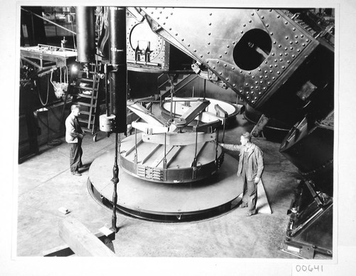 The 100-inch mirror in its hoisting machine, under the 100-inch telescope, Mount Wilson Observatory