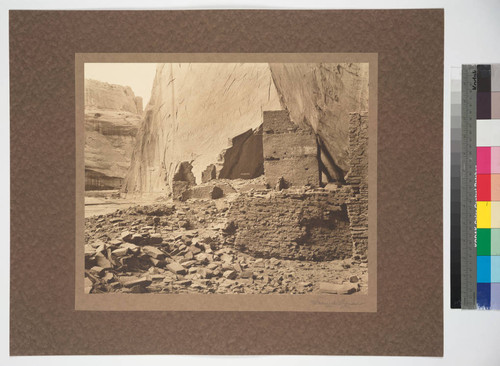 A canyon prehistoric building partly destroyed by falling rock from cliff wall. Del Muerto, Northeast Arizona