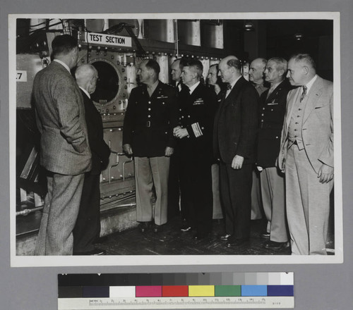 Edwin Powell Hubble, Henry Stimson, General Harris, Colonel Eddy, R.W. Kent and 5 other unidentified men viewing the supersonic wind tunnel at the U.S. Army Ballistic Research Laboratory